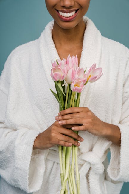Woman smiling softly while stretching, demonstrating self-care